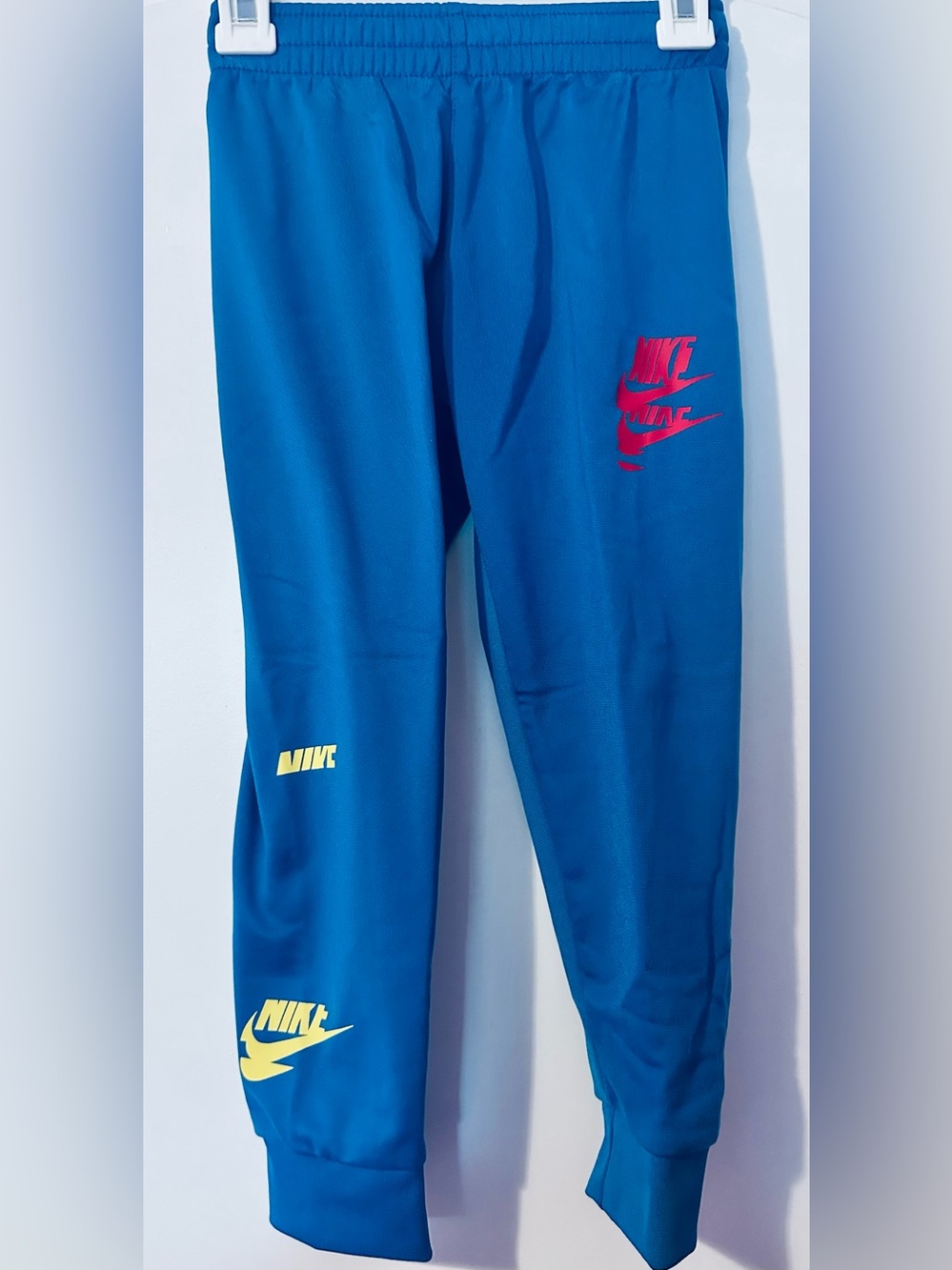 BNWT Nike Kids Blue 2-Piece Track Set with Red Blue and Yellow Logo - Picture 2 of 3